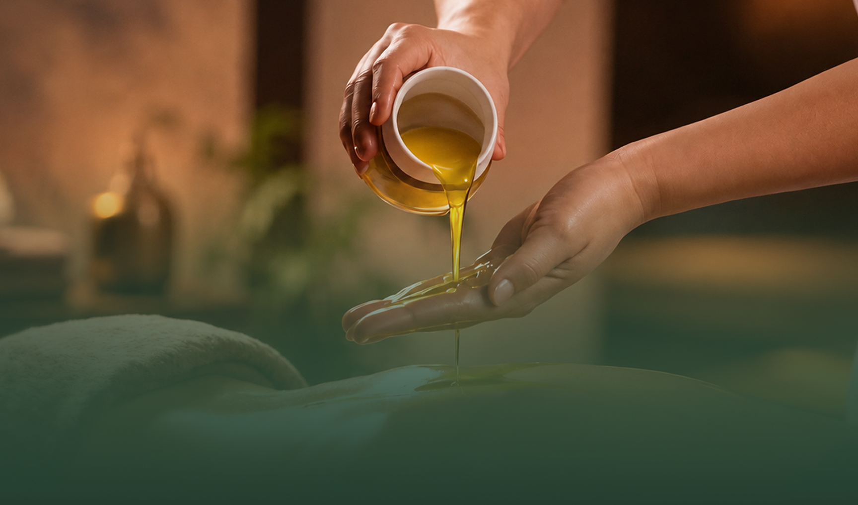 Warm herbal oil being poured during an Ayurvedic therapy